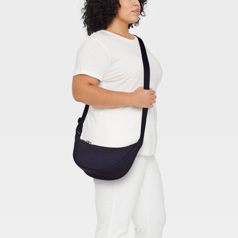slide 2 of 5, Essential Crescent Sling Crossbody Bag - Universal Thread™ Black: Adjustable Strap, Recycled Nylon, Lightweight Design, 1 ct