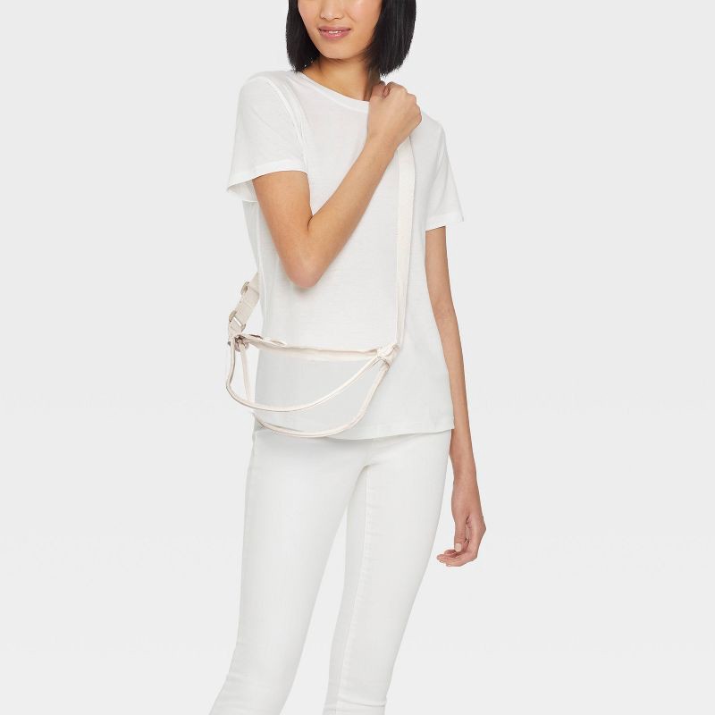 slide 2 of 5, Essential Crescent Sling Crossbody Bag - Universal Thread™ Clear/Cream: Adjustable Strap, Lightweight TPU, 1 ct