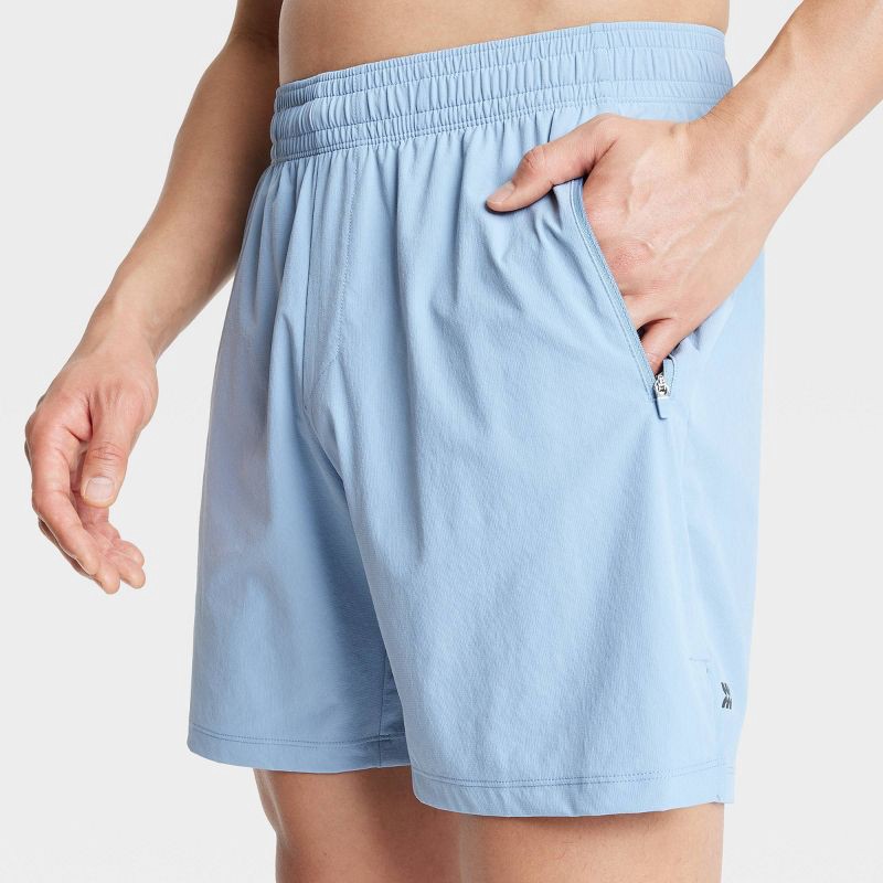 slide 3 of 3, Men's Stretch Woven Shorts 7" - All In Motion™ Light Blue L: Lightweight, Loose Fit, Adjustable Waistband, Side Pockets, 1 ct