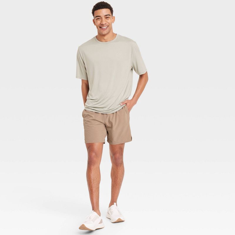 slide 3 of 3, Men's Active Light Unlined Run Shorts 7" - All In Motion™ Tan S: Adjustable Waistband, Zippered Pocket, 1 ct