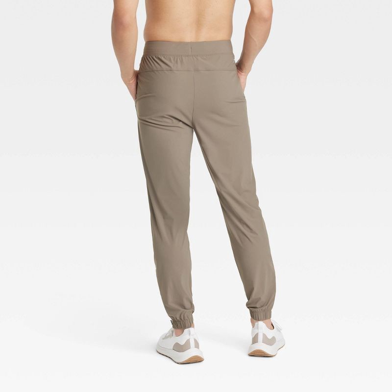 slide 2 of 3, Men's Lightweight Tricot Jogger Pants - All In Motion™ Taupe S: Mid Rise, Zippered Pocket, 1 ct