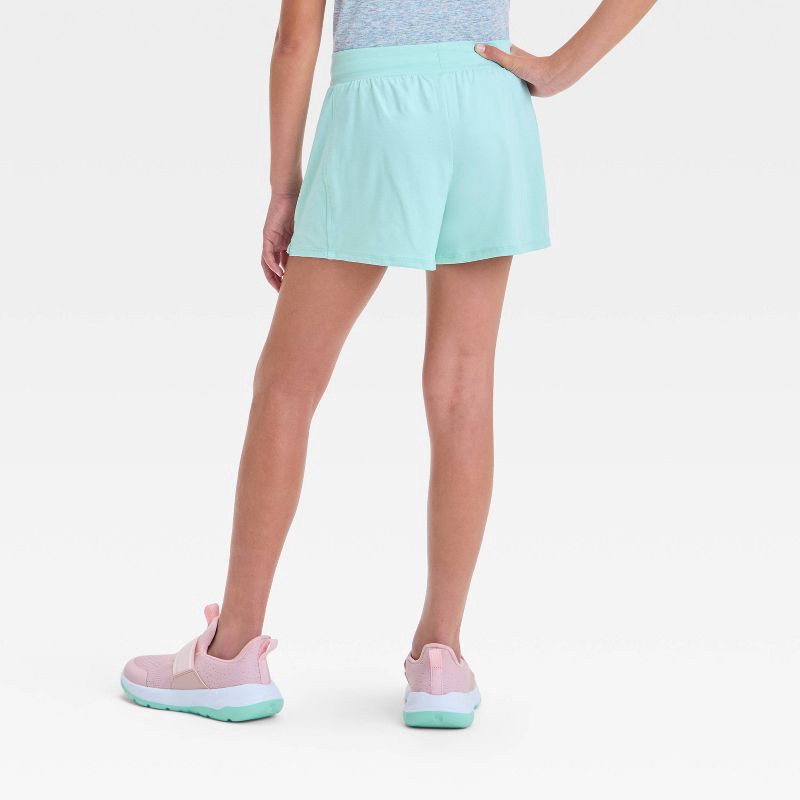 slide 2 of 3, Girls' Soft Stretch Shorts - All In Motion™ Light Teal Green L: Midweight, Moisture Wicking, Quick Drying, 1 ct