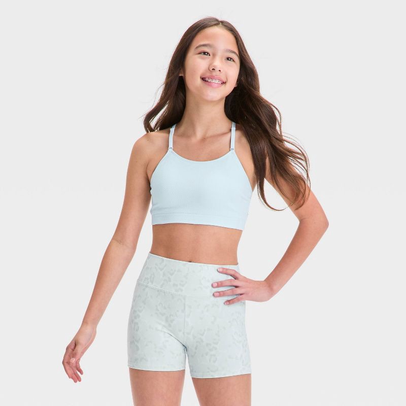 slide 1 of 3, Girls' Seamless Sports Bra - All In Motion™ Light Blue L: Racerback, Pullover, Removable Cup, Knit, 1 ct