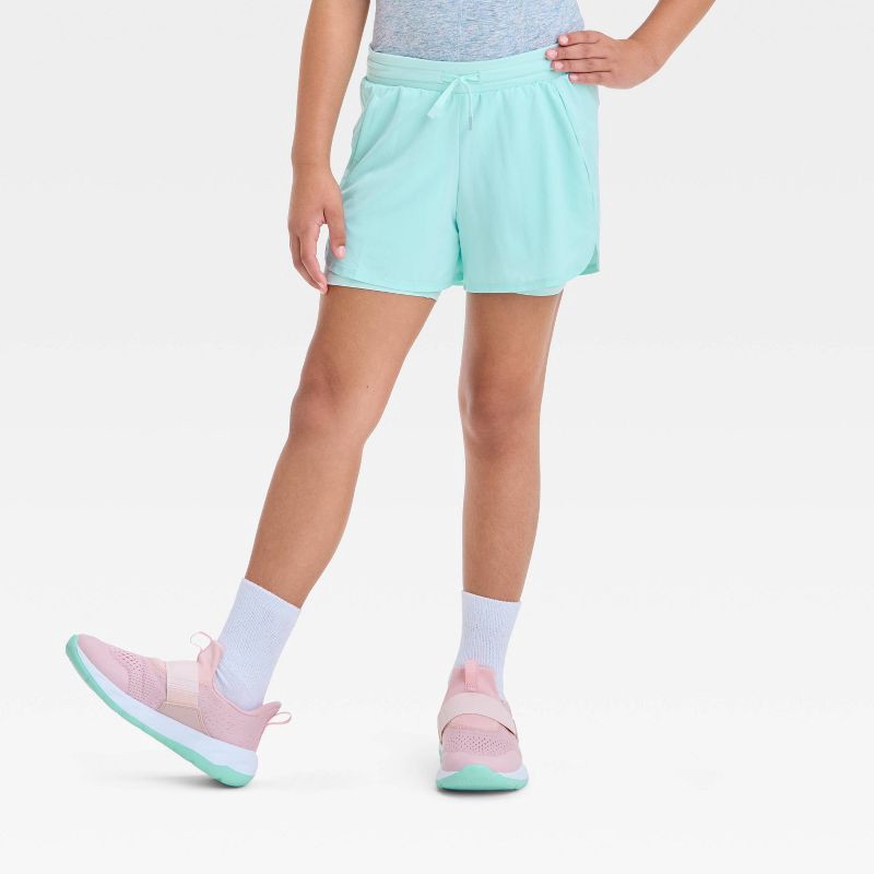 slide 1 of 3, Girls' Active Light 2-In-1 Run Shorts - All In Motion™ Light Teal Green M: Recycled Polyester, Spandex, Stash Pocket, 1 ct