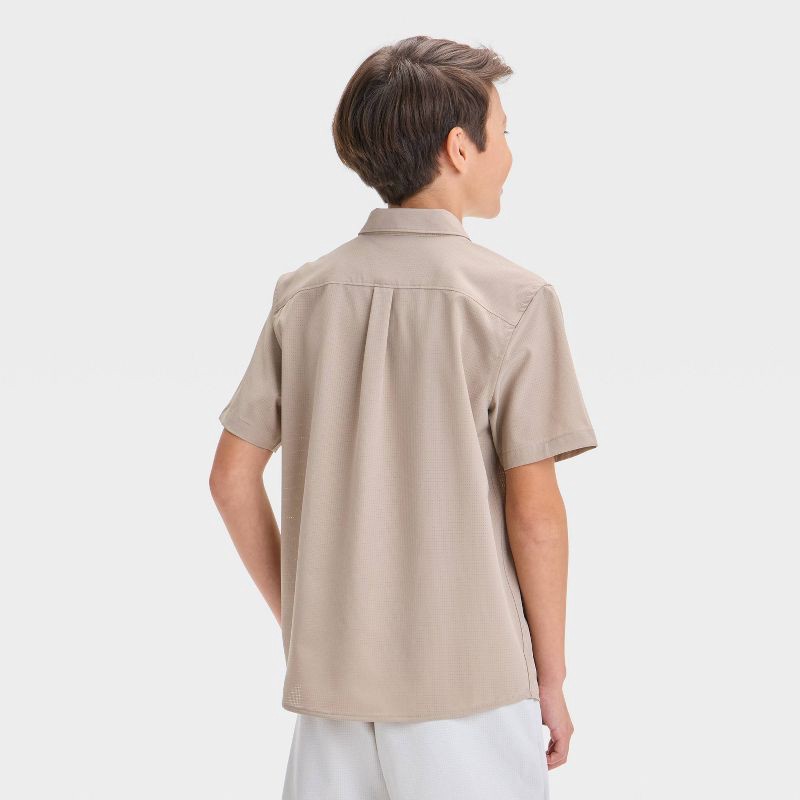 slide 2 of 3, Boys' Short Sleeve Adventure Shirt - All In Motion™ Tan S: Moisture Wicking, Quick Dry, Collared, Patch Pocket, 1 ct