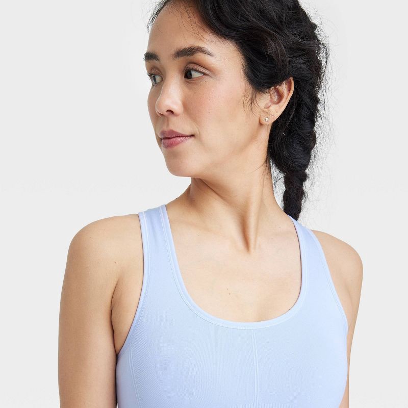 slide 5 of 5, Women's Seamless Medium Support Racerback Sports Bra - All In Motion™ Periwinkle Blue S: Moisture Wicking, Removable Cup, 1 ct