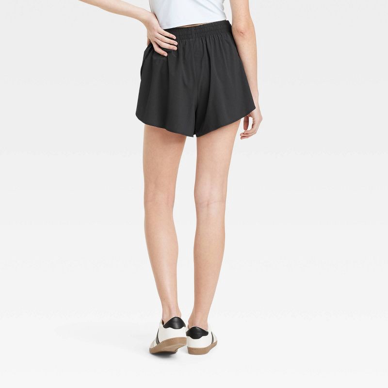 slide 2 of 6, Women's Woven High-Rise Flutter Shorts 2.5" - All In Motion Black L, 1 ct