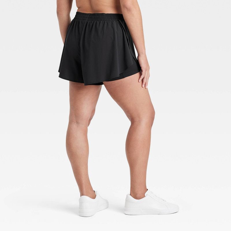 slide 4 of 6, Women's Woven High-Rise Flutter Shorts 2.5" - All In Motion Black L, 1 ct