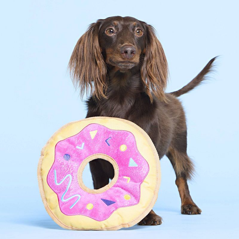 slide 4 of 5, BARK Doggy Bag Delivery Donut Dog Food Shaped Flying Disc Toy, 1 ct