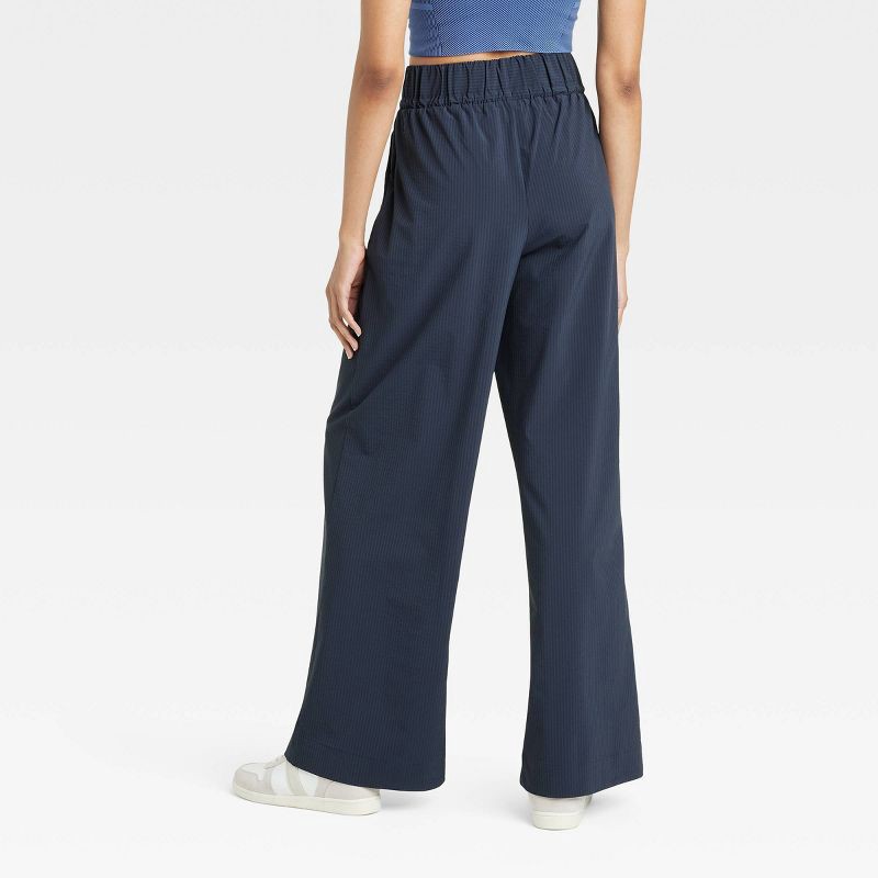 slide 2 of 5, Women's Woven High-Rise Seersucker Wide Leg Pants - All In Motion™ Navy Blue L: Recycled Polyester, Spandex, Moisture Wicking, Quick Dry, 1 ct