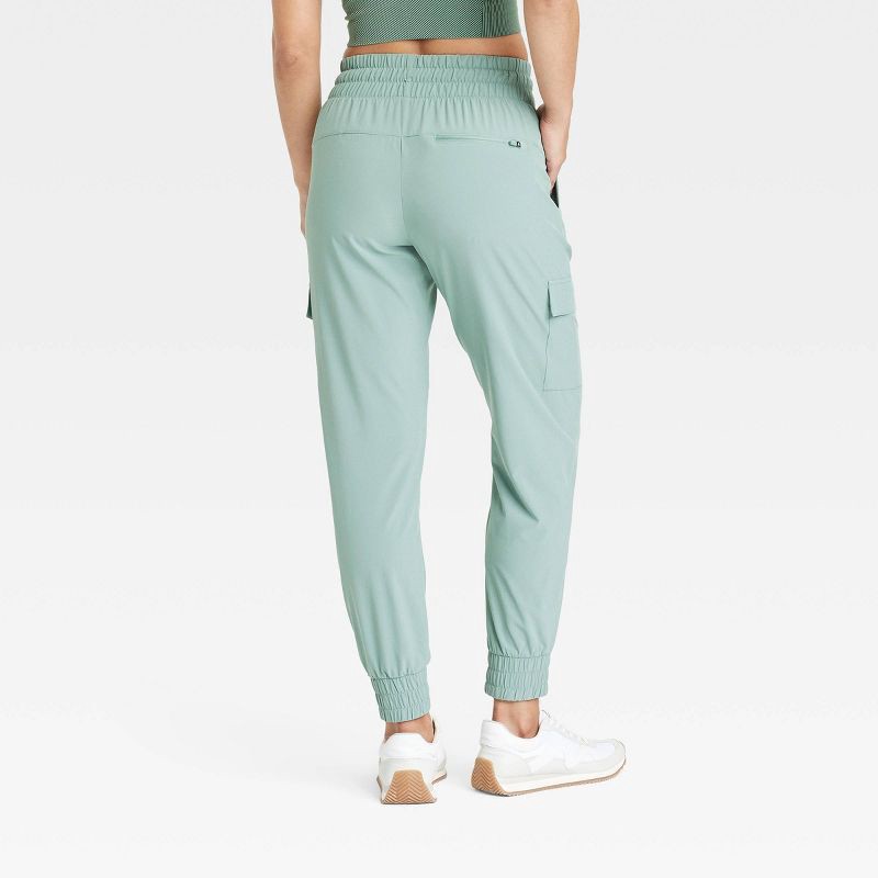 slide 2 of 6, Women's Active Light Mid-Rise Cargo Joggers - All In Motion™ Sage Green XS: Moisture Wicking, Quick Dry, UPF 50+, 1 ct