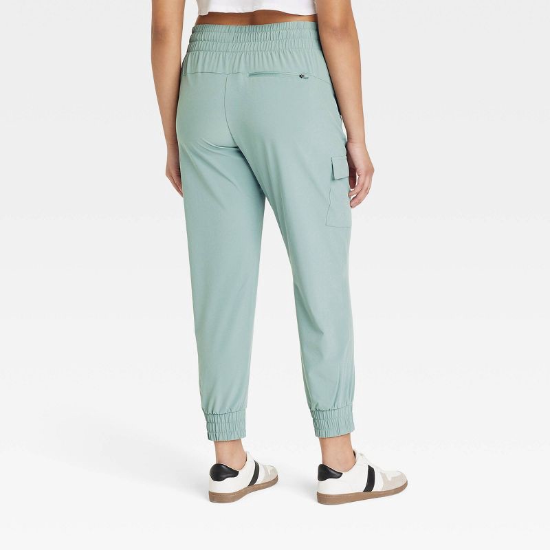 slide 4 of 6, Women's Active Light Mid-Rise Cargo Joggers - All In Motion™ Sage Green XS: Moisture Wicking, Quick Dry, UPF 50+, 1 ct