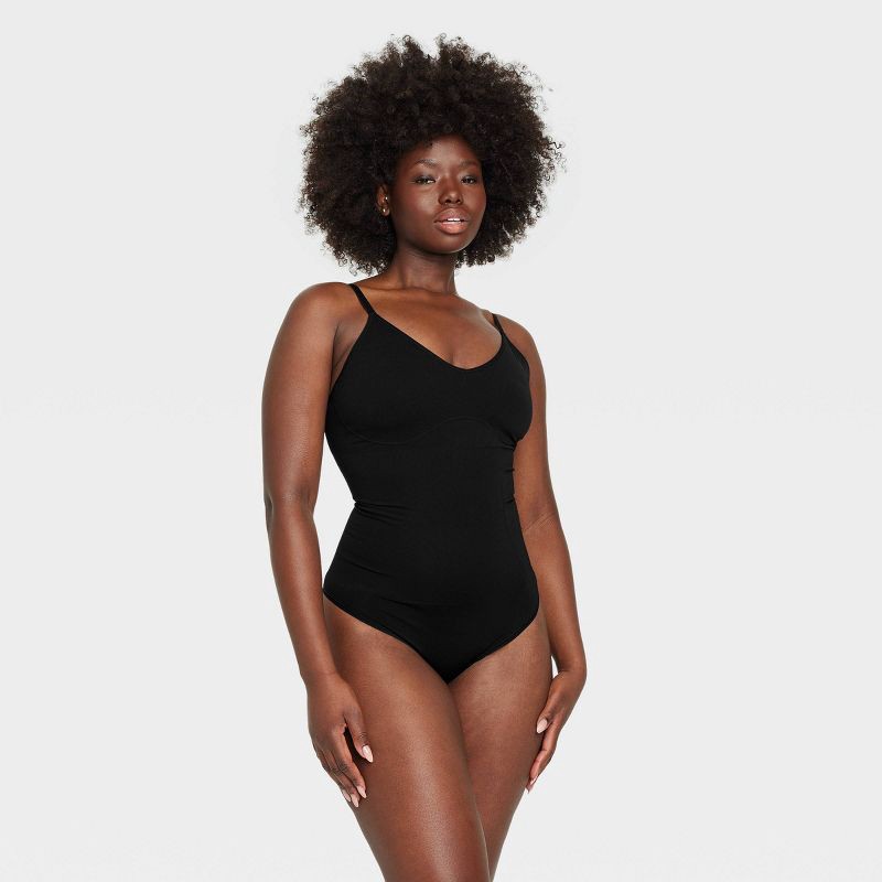 slide 4 of 6, Women's Medium Shaping Seamless Thong Bodysuit - Auden™ Black M: Medium Compression, Tummy Slimming, Adjustable Strap, 1 ct
