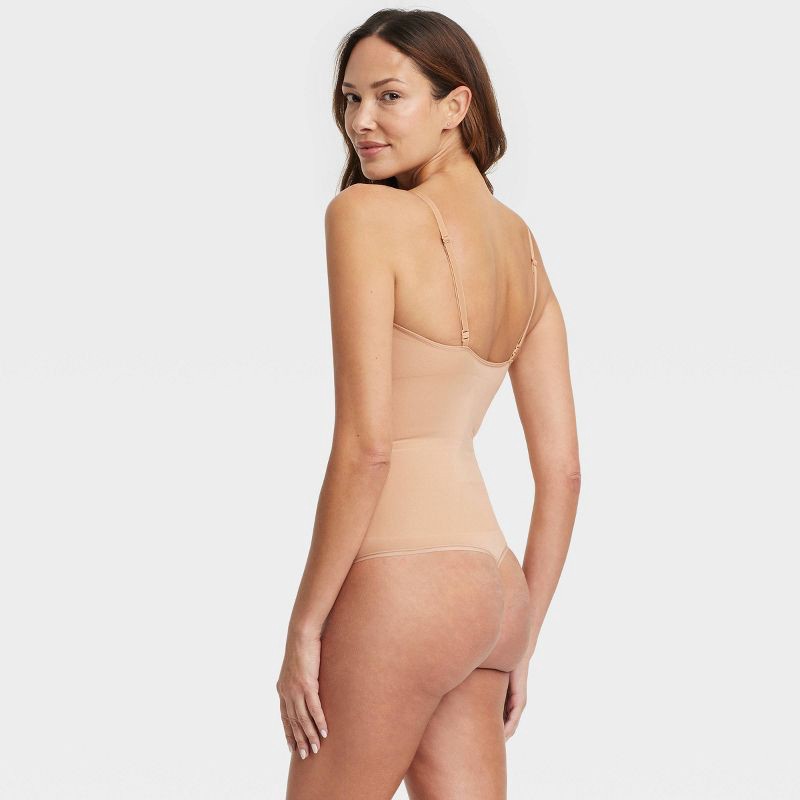 slide 2 of 6, Women's Medium Shaping Seamless Thong Bodysuit - Auden™ Pearl Tan XS: Nylon Spandex, Adjustable Strap, 1 ct