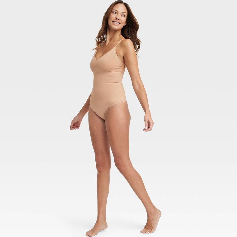 slide 3 of 6, Women's Medium Shaping Seamless Thong Bodysuit - Auden™ Pearl Tan S: Nylon Spandex Blend, Adjustable Straps, Tummy Slimming, 1 ct