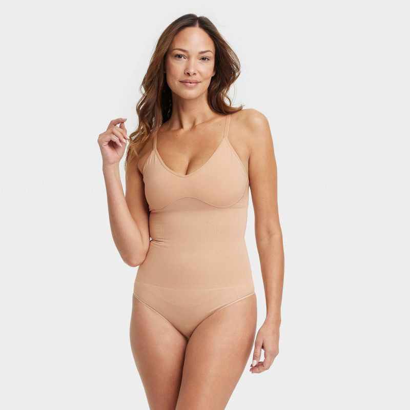slide 1 of 6, Women's Medium Shaping Seamless Thong Bodysuit - Auden™ Pearl Tan M: Medium Compression, Adjustable Strap, 1 ct