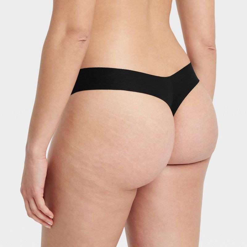 slide 2 of 5, Women's Invisible Edge Cotton Thong Underwear - Auden™ Black M: Seamless, Low Rise, Midweight Fabric, 1 ct
