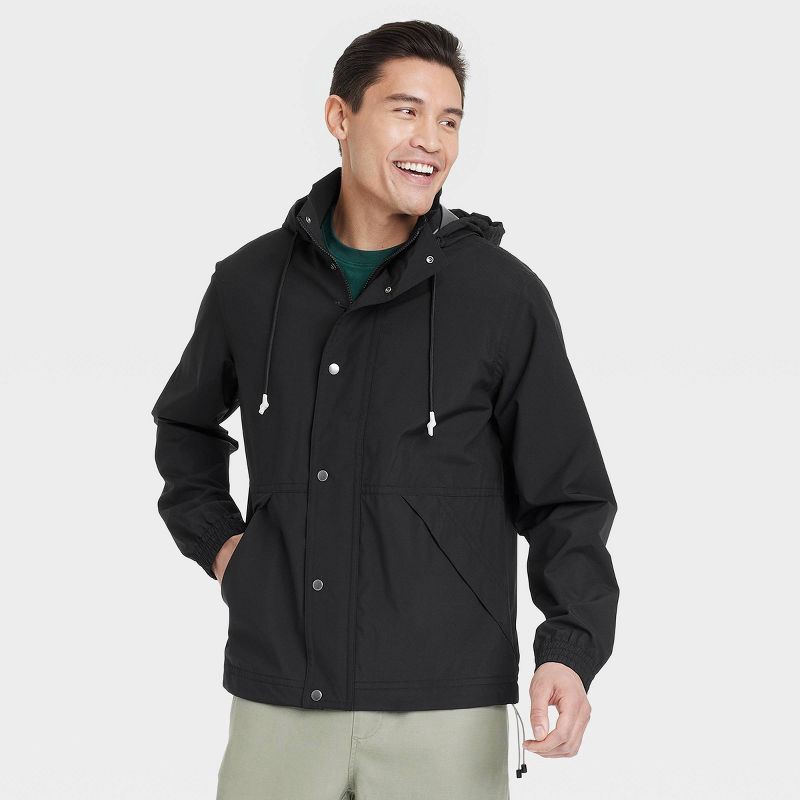 slide 1 of 3, Men's Hooded Rain Coat - Goodfellow & Co™ Black S: Lightweight Wind-Resistant Ripstop Fabric, Elastic Banded Cuffs, 1 ct