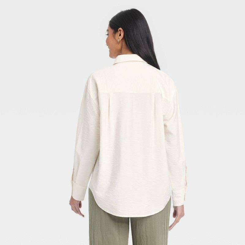 slide 2 of 3, Women's Oversized Long Sleeve Crinkle Button-Down Shirt - A New Day™ Cream S: Rayon-Nylon Blend, Poplin Fabric, 1 ct