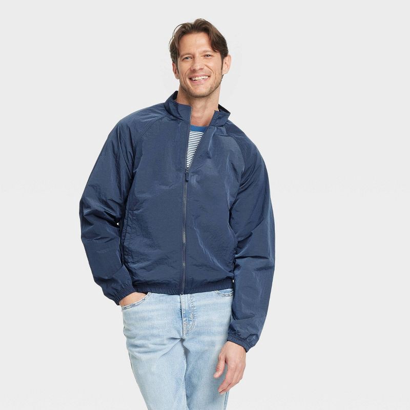 slide 1 of 3, Men's Windbreaker - Goodfellow & Co™ Navy Blue M: Lightweight, Wind-Resistant, Elastic Cuffs, Stand Collar, 1 ct