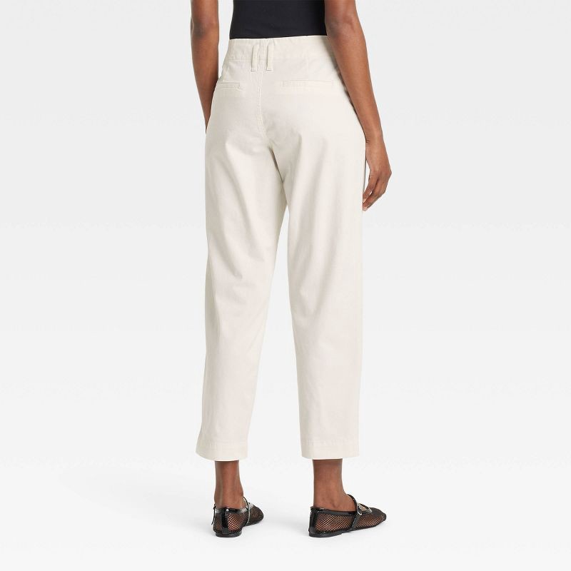slide 2 of 3, Women's High-Rise Tapered Ankle Chino Pants - A New Day™ Off-White 16: Cotton Spandex, Relaxed Fit, Belt Loops, 1 ct