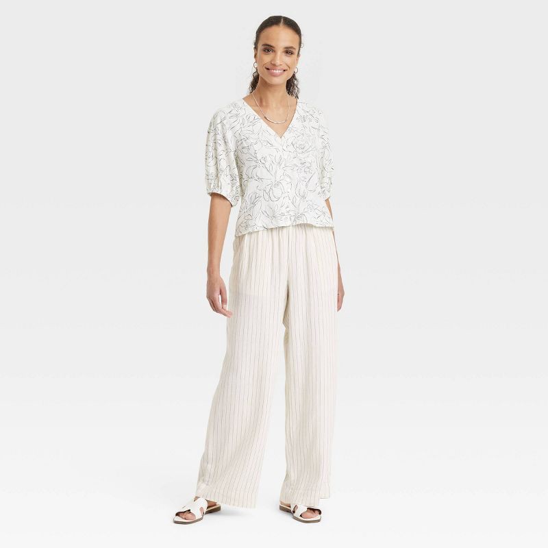 slide 3 of 3, Women's Mid-Rise Wide Leg Linen Pull-On Pants - A New Day™ White Striped L: Seam Pocket, Adjustable Waistband, 1 ct