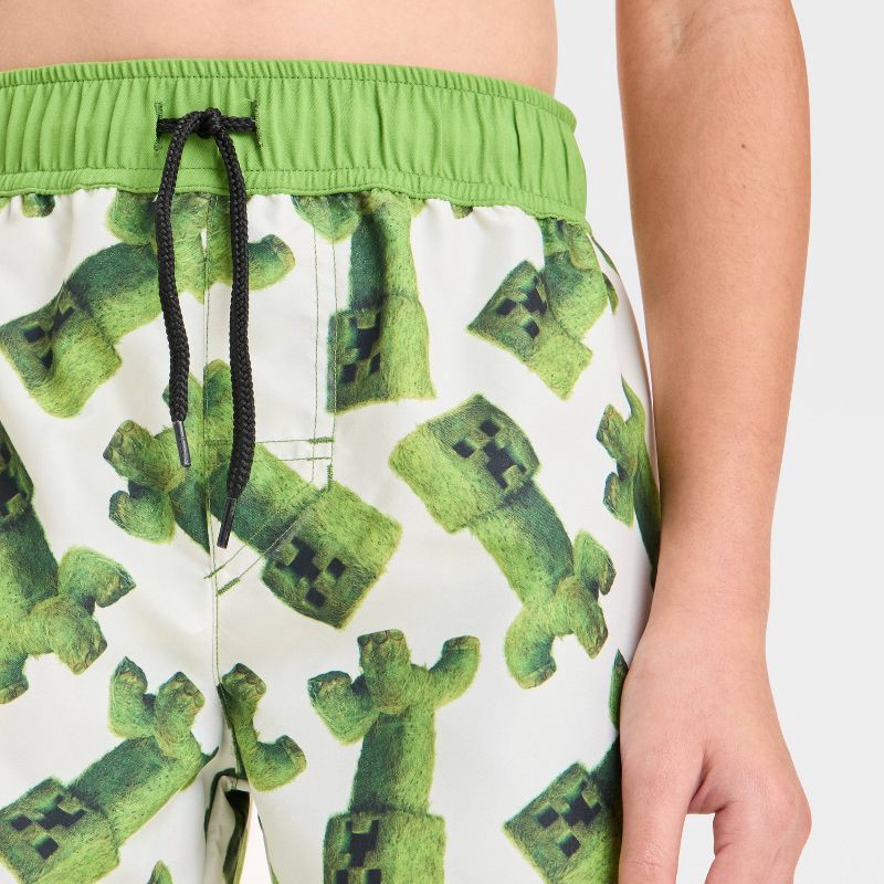 slide 3 of 3, Boys' Minecraft Movie Art Swim Shorts - White/Green S: UPF 50+ Microfiber Board Shorts, 1 ct