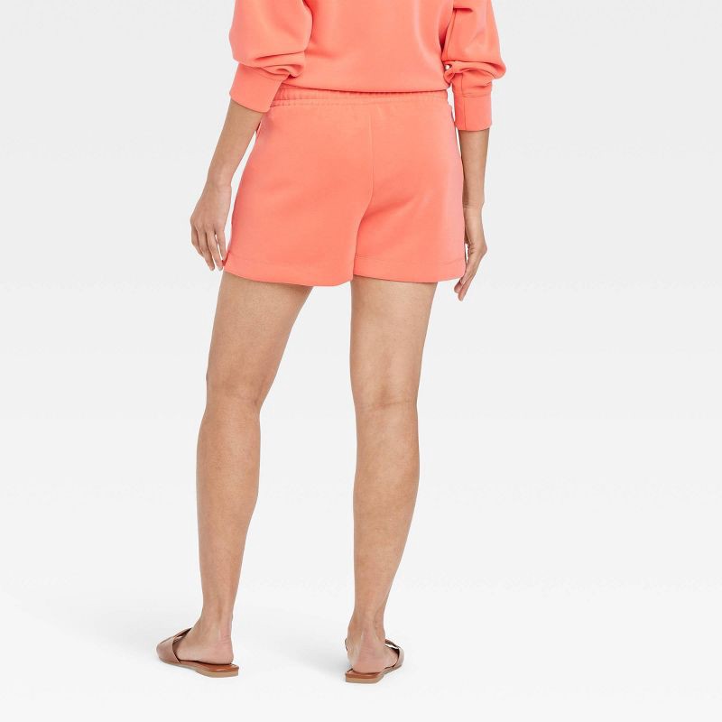 slide 2 of 3, Women's High-Rise Sandwash Pull-On Shorts - A New Day™ Coral M: Recycled Polyester, Slash Pocket, Elastic Waistband, 1 ct