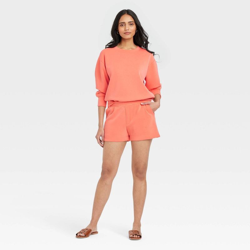 slide 3 of 3, Women's High-Rise Sandwash Pull-On Shorts - A New Day™ Coral M: Recycled Polyester, Slash Pocket, Elastic Waistband, 1 ct