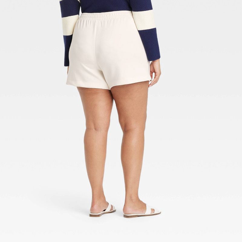 slide 2 of 3, Women's High-Rise Sandwash Pull-On Shorts - A New Day™ Off-White XXL: Recycled Polyester, Rayon, Spandex, Heavyweight Fabric, Slash Pocket, 1 ct