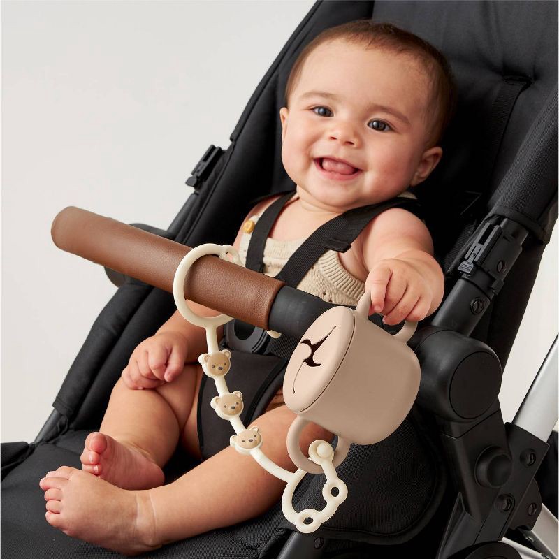 slide 2 of 8, Itzy Ritzy Itzy Strap Toy and Snack Cup Strap for Strollers & High Chairs - Tan Bear, 1 ct
