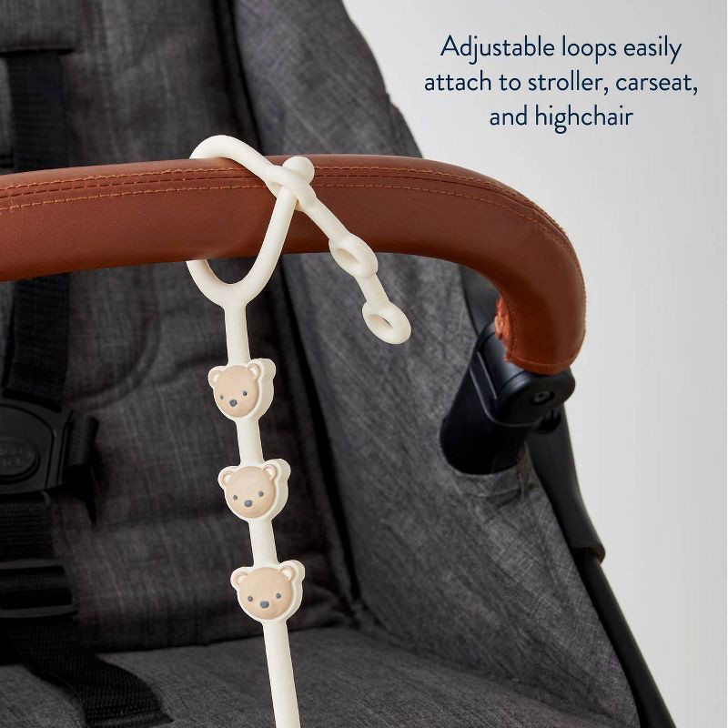 slide 6 of 8, Itzy Ritzy Itzy Strap Toy and Snack Cup Strap for Strollers & High Chairs - Tan Bear, 1 ct