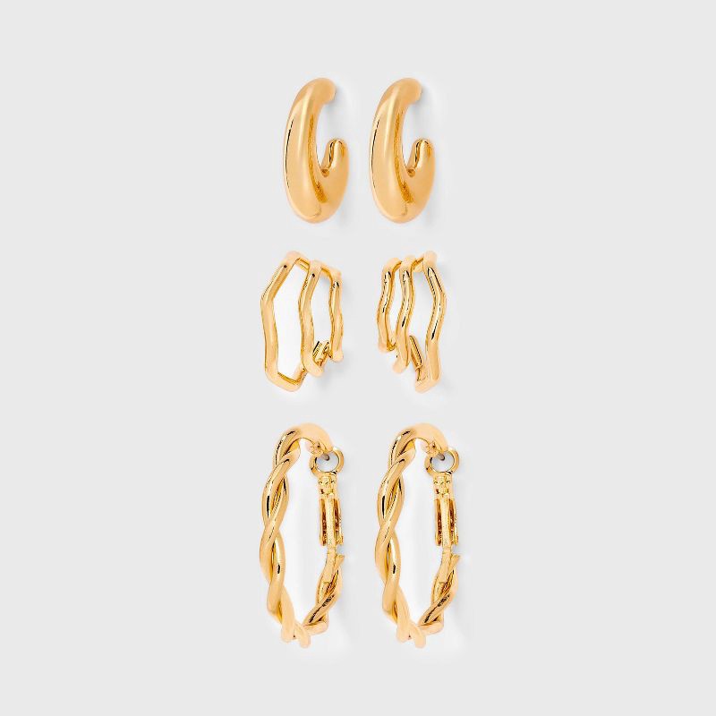 slide 1 of 3, Twisted Hoop Earring Set 3pc - Universal Thread™ Gold: Steel Material, Post Closure, 1.25" Length, 3 ct