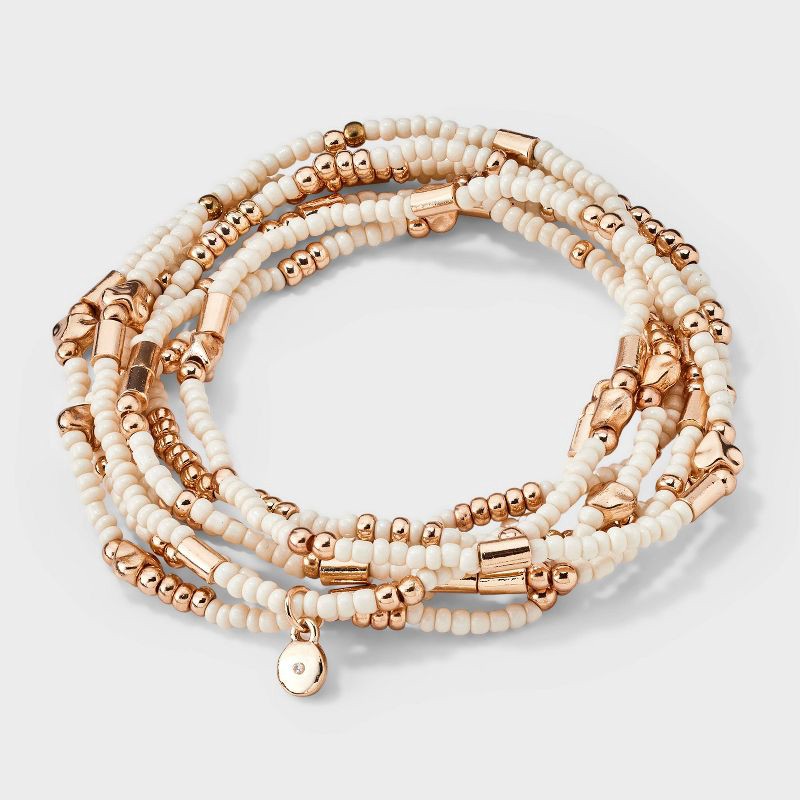 slide 1 of 4, Heart Beaded Bracelet Set 7pc - Universal Thread™ Ivory: Pull-On Stretch Bracelets, Glass & Acrylic, Heart Shape, 2.2" Length, 7 ct