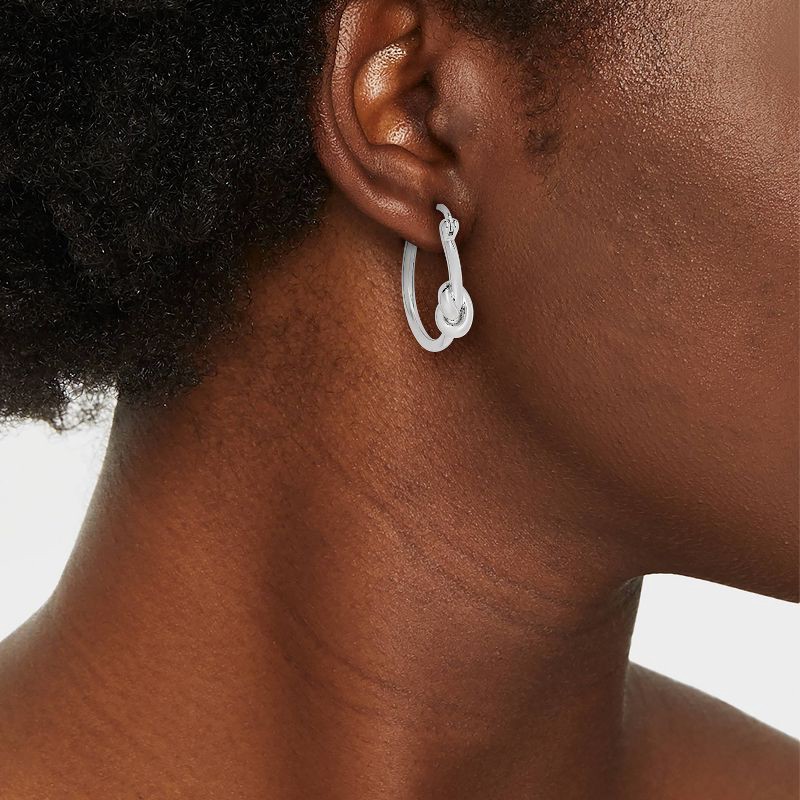 slide 2 of 3, Sterling Silver Knotted Smooth Hoop Earrings - A New Day™: Clip-In Clasp, Polished Finish, Nickel-Free, 1.02" Length, 1 ct