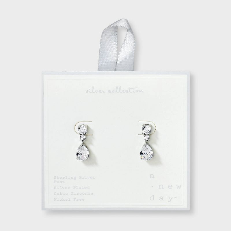slide 1 of 3, Silver Plated Cubic Zirconia Pear Drop Earrings - A New Day™: Polished Brass, Nickel-Free, Simulated Stones, Post Closure, 1 ct