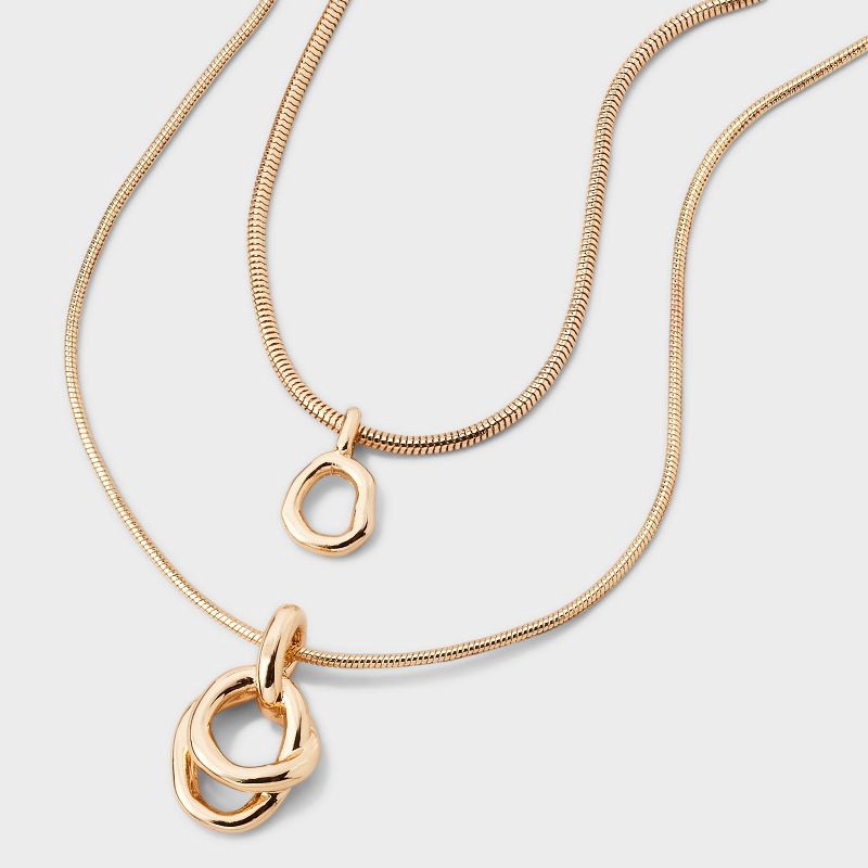 slide 1 of 4, Interlock Circle Pendant Multi-Strand Necklace - A New Day™ Gold: Nickel-Free Metal, Lobster Claw Clasp, 1 ct
