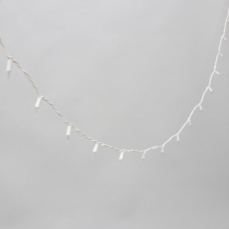 slide 3 of 5, Philips 100ct Heavy Duty Incandescent Smooth Mini String Lights with Green Wire and Remains Lit Technology, 100 ct