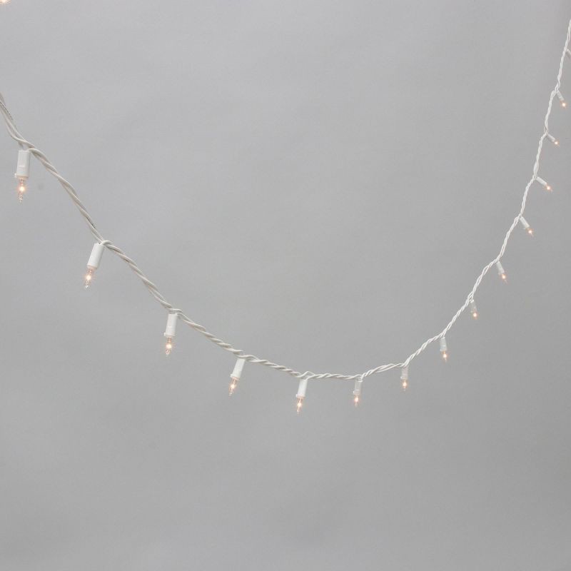 slide 1 of 5, Philips 100ct Heavy Duty Incandescent Smooth Mini String Lights with Green Wire and Remains Lit Technology, 100 ct