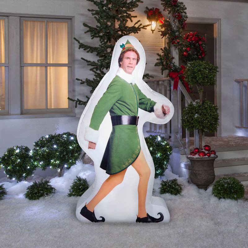 slide 2 of 4, Warner Bros. 6' Christmas Indoor/Outdoor Lighted Inflatable Strolling Buddy the Elf, 1 ct