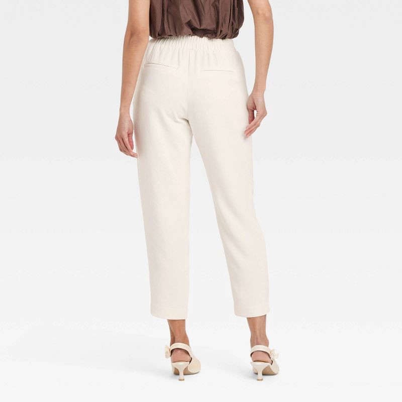 slide 2 of 3, Women's Signature Crepe Tapered Ankle Pull-On Pants - A New Day™ Off-White XS: High Rise, Back Elastic, 27" Inseam, 1 ct