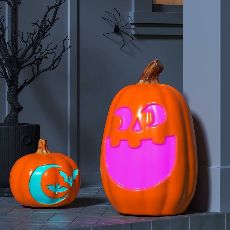 slide 2 of 3, 9" Lit Pumpkin with Moon and Bats Halloween Decorative Prop - Hyde and EEK! Boutique™, 1 ct