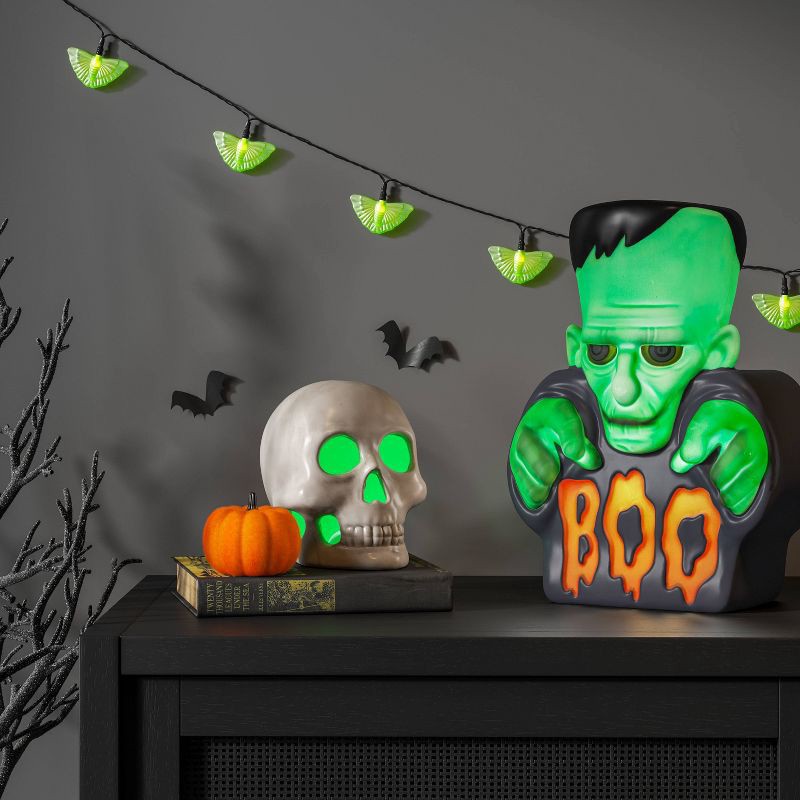slide 2 of 3, 12" Lit Monster Boo Blow Mold Halloween Decorative Prop Green - Hyde and EEK! Boutique™, 1 ct