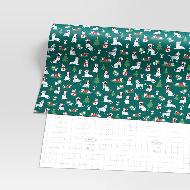 slide 3 of 3, 30" 50 sq ft Christmas Roll Wrap Illustrated Dogs on Green - Wondershop™, 50 sq ft