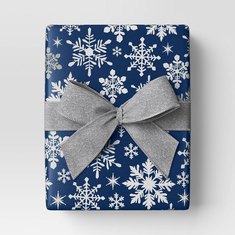 slide 2 of 3, 30" 25 sq ft Christmas Roll Wrap White Snowflakes on Blue - Wondershop™, 25 sq ft