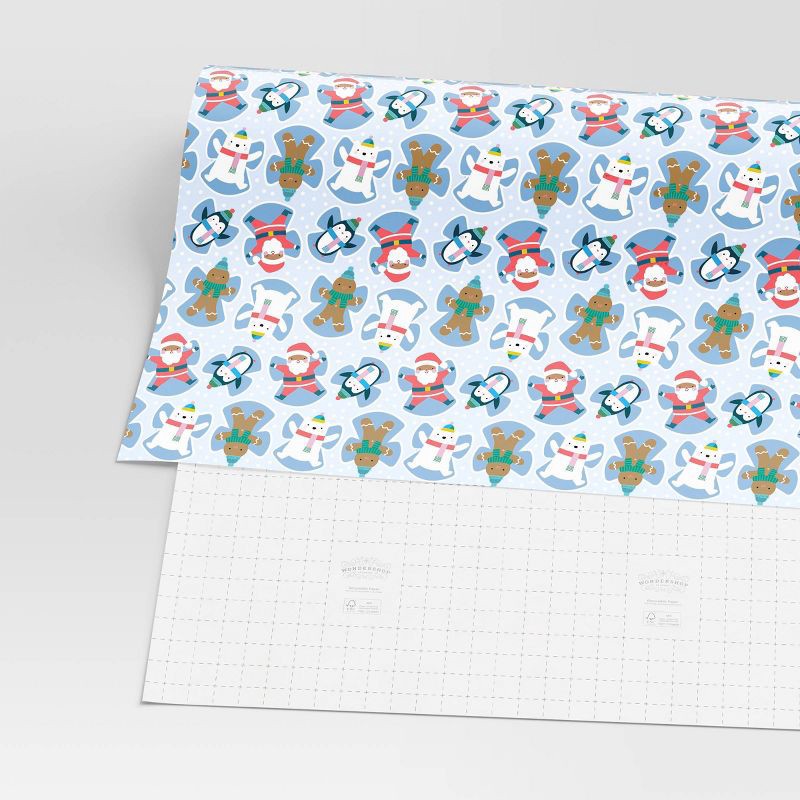 slide 3 of 3, 30" 50 sq ft Christmas Roll Wrap Character Snow Angels on Blue - Wondershop™, 50 sq ft
