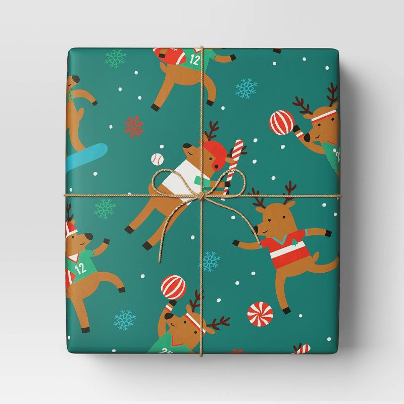 slide 2 of 3, 30" 50 sq ft Christmas Roll Wrap Reindeer Games on Green - Wondershop™, 50 sq ft