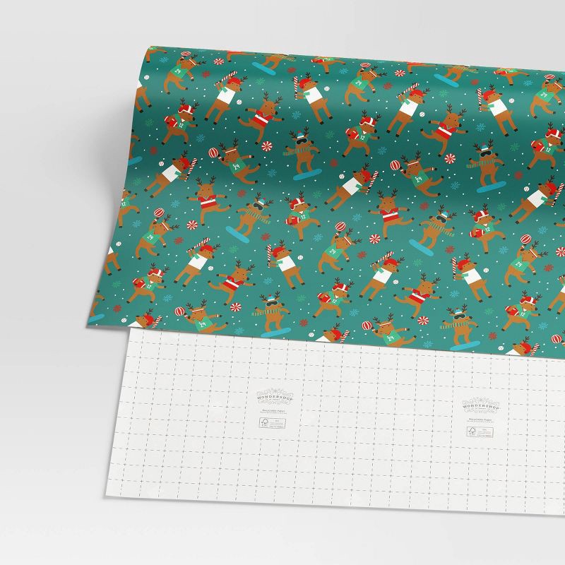 slide 3 of 3, 30" 50 sq ft Christmas Roll Wrap Reindeer Games on Green - Wondershop™, 50 sq ft