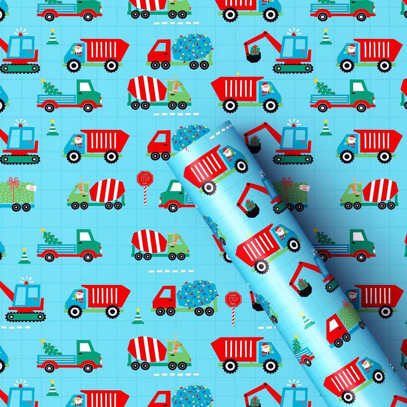 slide 1 of 3, 30" 50 sq ft Christmas Roll Wrap Trucks on Blue - Wondershop™, 50 sq ft