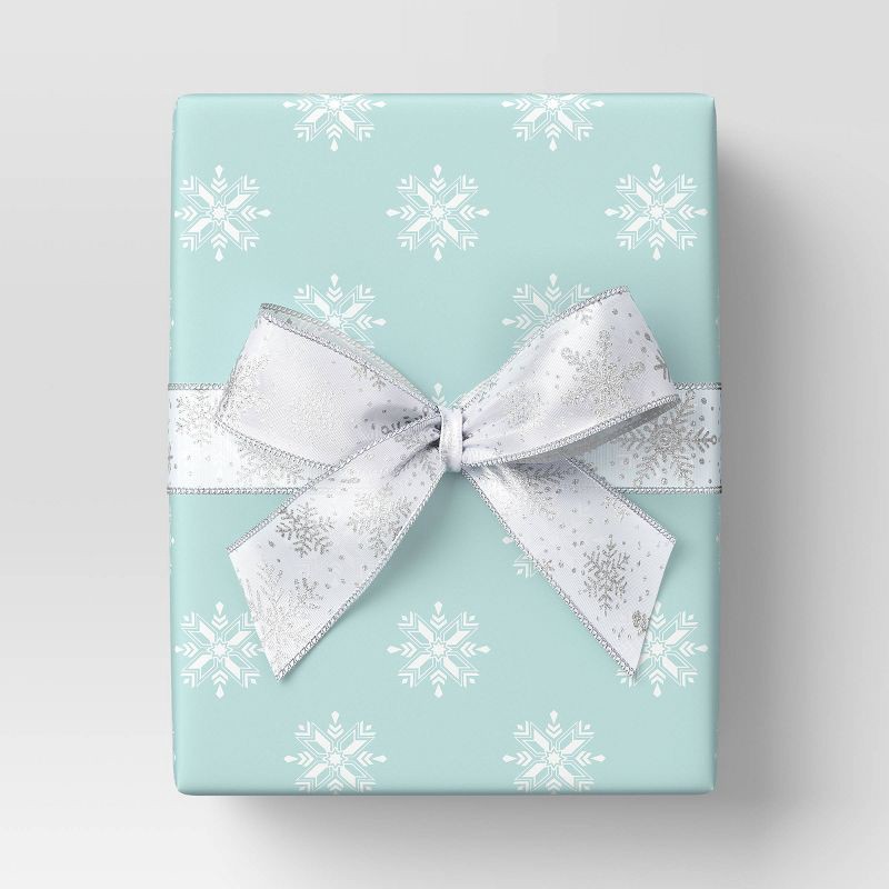 slide 2 of 3, 30" 20 sq ft Christmas Roll Wrap White Snowflakes on Light Blue - Wondershop™, 20 sq ft